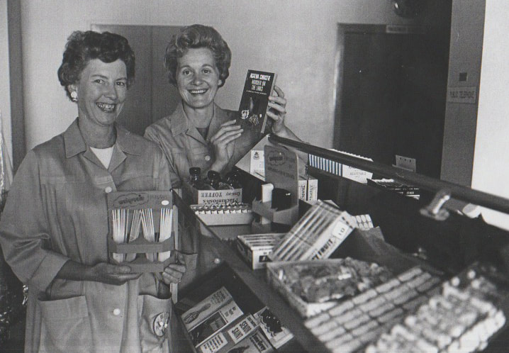 Hospital Auxiliary Volunteers, Mrs. A.E.Rowe and Mrs. M.H.Cook displaying items for sale on the new hospital cart 1968