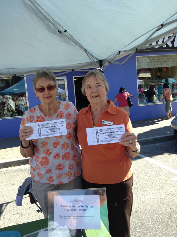 Selling West Jet Raffle tickets at the Downtown Community Market